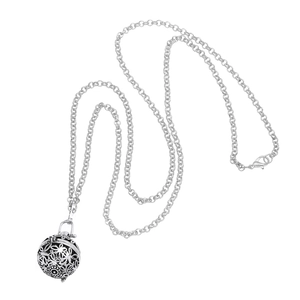 Vintage hollow sphere locket necklace with intricate floral carving on long O-chain