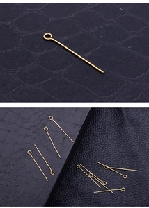 Detailed macro view of golden stainless steel eye pins for DIY earring jewelry making