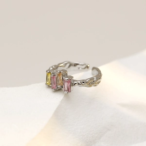 Silver irregular open ring with colorful rectangular crystals in minimalist setting