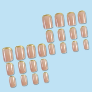 French tip press-on nails with nude base and gold metallic edges in 24-piece set