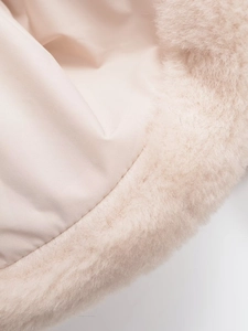 Detailed macro view of soft pink faux fur material and premium smooth fabric lining