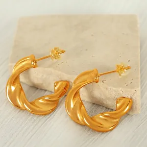 Minimalist twisted C-shape gold titanium steel earrings with metal and silicone backs