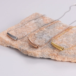 Minimalist chili pepper pendant necklace set in silver, gold, and rose gold finishes