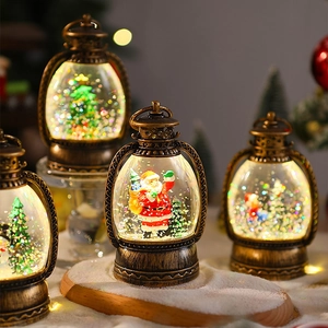 Macro view of vintage bronze Christmas lantern globe with Santa Claus and festive glitter