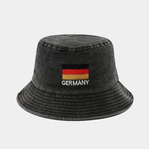 Close-up of Germany flag embroidery on a washed grey denim bucket hat with metal eyelets