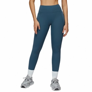 High waisted compression yoga leggings in dark teal with side pockets for fitness