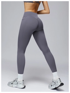 Detail view of high-waisted yoga pants with butt-lifting seams and functional side pockets