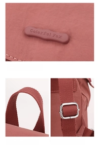 Detail view of pink nylon mini backpack showing logo and adjustable straps by Colorful Fox