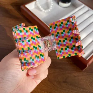 Colorful checkered acrylic hair claw clip with square geometric design for women