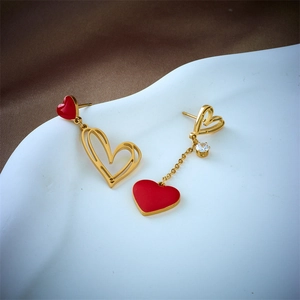 Asymmetric heart drop earrings in gold titanium steel with red enamel and zircon detail