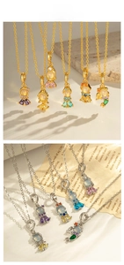Detailed view of mermaid doll pendants with colorful gemstones in gold and silver finish