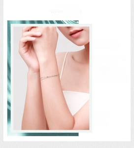 Detail of a minimalist 925 sterling silver double-layer bracelet worn on a female wrist