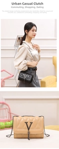 Close-up of quilted chain crossbody bag featuring V-shaped logo and elegant metal tassels