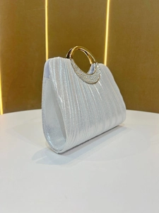 Elegant silver pleated evening clutch bag with sparkling diamond-encrusted round handle