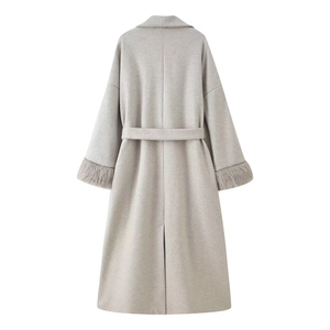 Elegant long grey wool coat for women with belted waist and plush faux fur cuffs