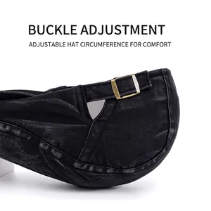 Adjustable black washed denim beret cap with vintage bronze buckle detail