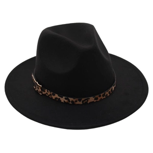 Detail of black wool felt fedora featuring a leopard print band and gold buckle accent