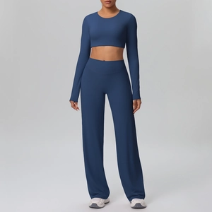 Navy blue yoga set featuring long sleeve cropped top and high waist wide leg pants