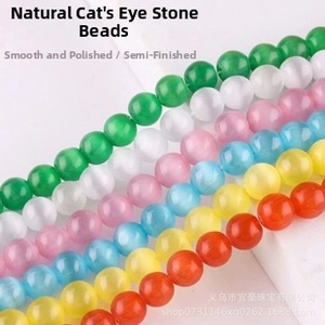 Macro detail of multicolored cat eye stone beads for DIY jewelry with light reflection
