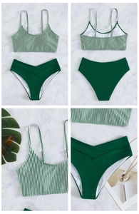 Detail view of striped bikini top and high-waisted bottoms with criss-cross waist design
