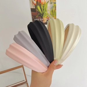 Detail of colorful sponge headbands with unique wavy texture and matte finish