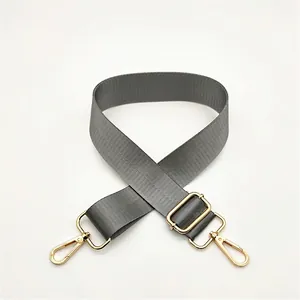 Adjustable grey nylon replacement shoulder strap with polished gold-tone metal lobster clasps