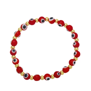 Detail view of Evil Eye beaded bracelet with red evil eye charms and golden metal spacer beads