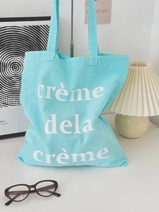 Mintgrüne Canvas-Tragetasche mit weißem crème dela crème-Druck für lässige Sommerreisen