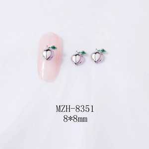 Macro view of peach-shaped alloy nail charms with purple enamel and 8x8mm size scale