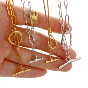 18k gold and silver stainless steel necklaces with OT toggle clasps shown on hands