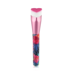 Macro view of heart-shaped gradient makeup brush bristles with floral patterned handle