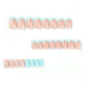 Blue French tip press-on nails with heart accents and glossy finish 24-piece set