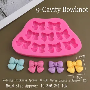 Pink 9-cavity bow silicone mold with measurements showing bow shape and sizes