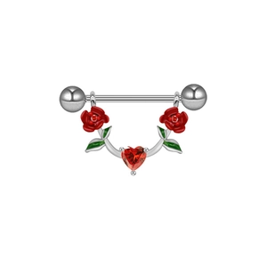 Macro detail of red enamel flowers and heart-shaped gemstone on stainless steel nipple ring