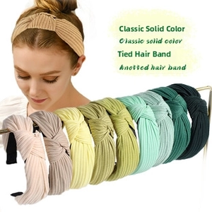Detail showing ribbed knit knotted headbands in various soft pastel solid colors