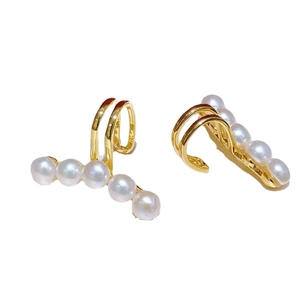 Freshwater pearl gold ear clips for women featuring double-row curved minimalist design