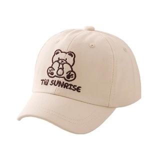 Kids beige cotton baseball cap featuring a brown cartoon bear embroidery and text