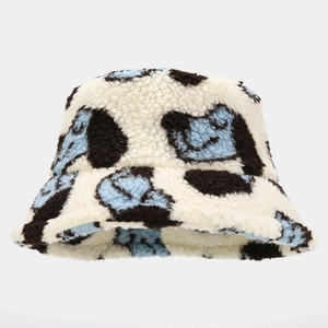 Close-up of thick sherpa fleece bucket hat featuring blue and brown leopard spot patterns