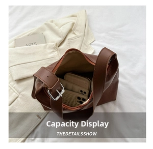 Detailed interior view of a brown retro tote bag showing large capacity for items