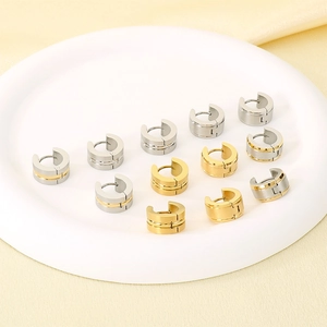 Minimalist C-shaped stainless steel huggie earrings in gold and silver finish