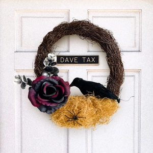 Halloween wreath with black raven, dark red rose and bird nest on white door decoration
