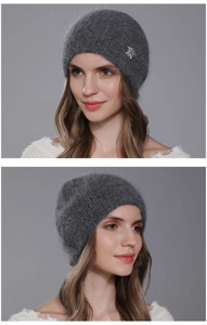 Close-up of a grey angora knit beanie with a sparkling silver snowflake rhinestone detail