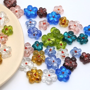 Macro detail of colorful floral glass beads for DIY jewelry making and craft projects