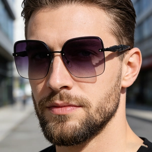 Detail of fashion oversized sunglasses with purple gradient lenses and marble temples
