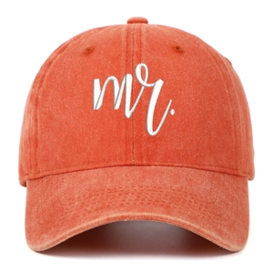Detail of Mr. white embroidery on vintage washed cotton baseball cap in brick red