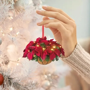 Flat acrylic Christmas basket ornament with red poinsettias and LED lights on a white tree