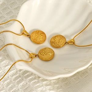 Three gold flower coin pendant necklaces with engraved marigold and poppy on snake chains