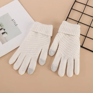 Close-up of white knit gloves with grey conductive touchscreen fingertips on a stylish set