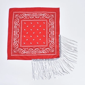 Red paisley bandana featuring classic white patterns and elegant silver fringe tassels