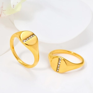 French style gold signet ring featuring a vertical line of clear pavé zircon stones